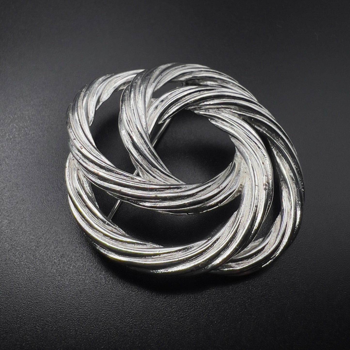 Vintage Beautiful Monet Signed Twisted Knot Silver-Toned Textured Brooch Pin