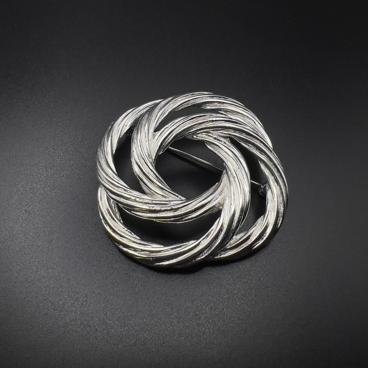 Vintage Beautiful Monet Signed Twisted Knot Silver-Toned Textured Brooch Pin