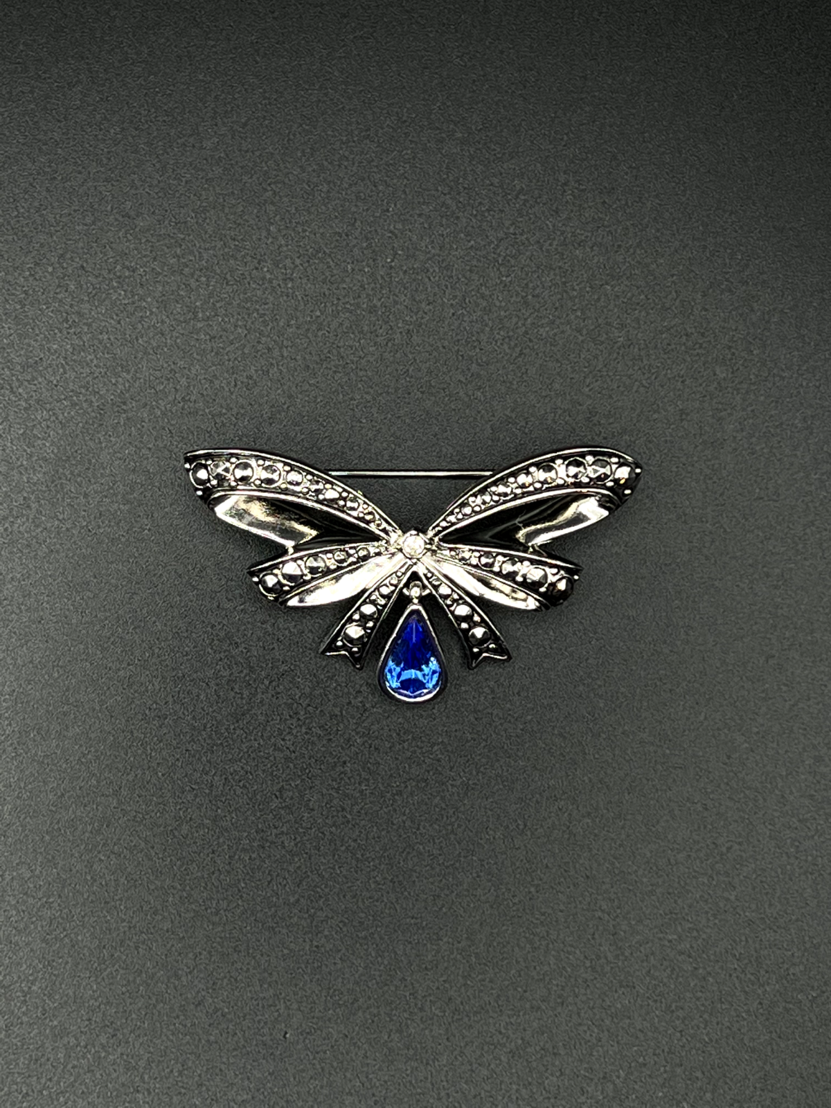 Vintage Avon signed Silver-Toned Bow a Blue Glass Teardrop Rhinestone Brooch Pin