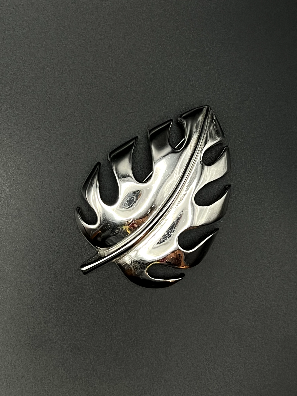 "Vintage TRIFARI silver leaf brooch pin front view showing intricate leaf design"