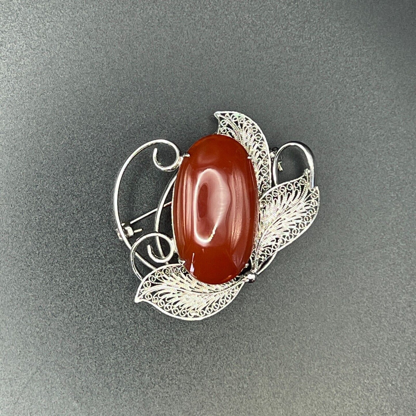 Vintage Silver-Toned Filigree with a Large Reddish Brown Cabochon Brooch Pin