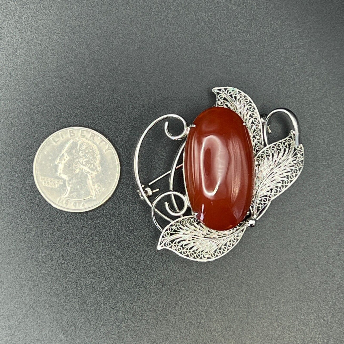 Vintage Silver-Toned Filigree with a Large Reddish Brown Cabochon Brooch Pin