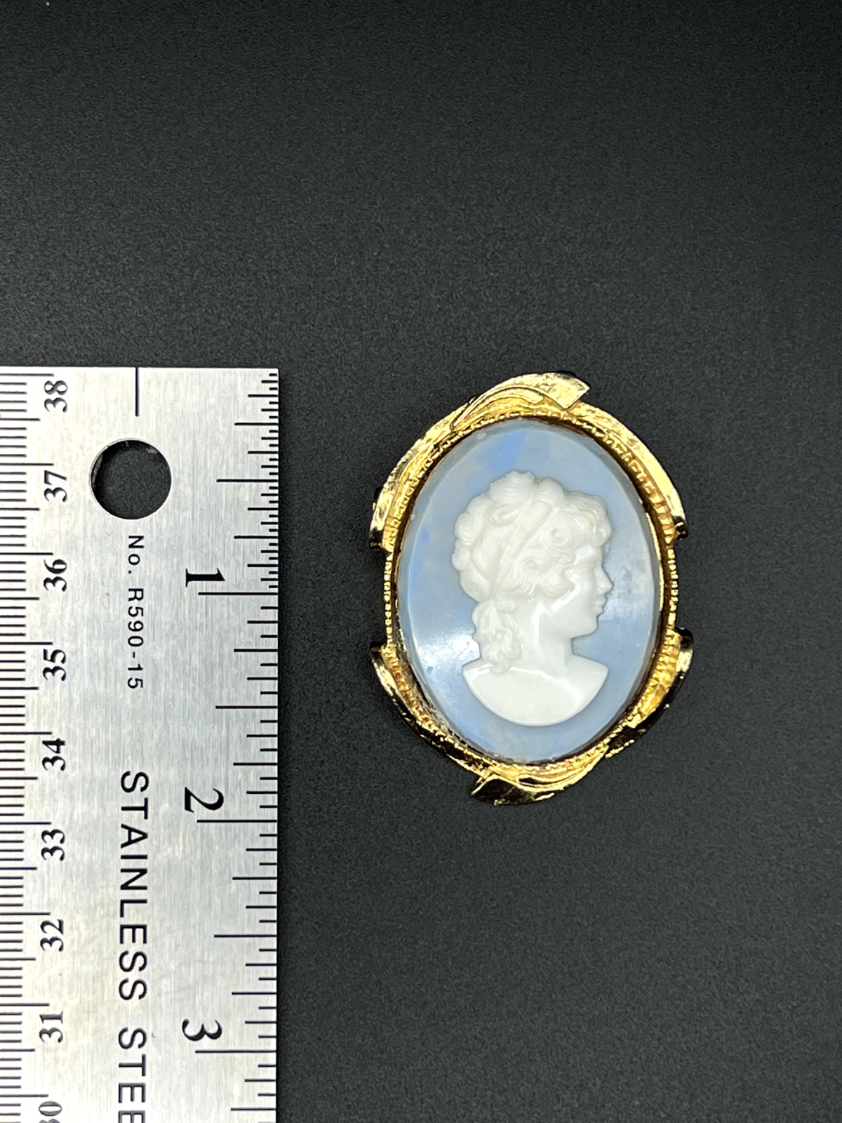 Vintage Raised Gold-Toned Framed White Cameo on a Blue Background Brooch Pin